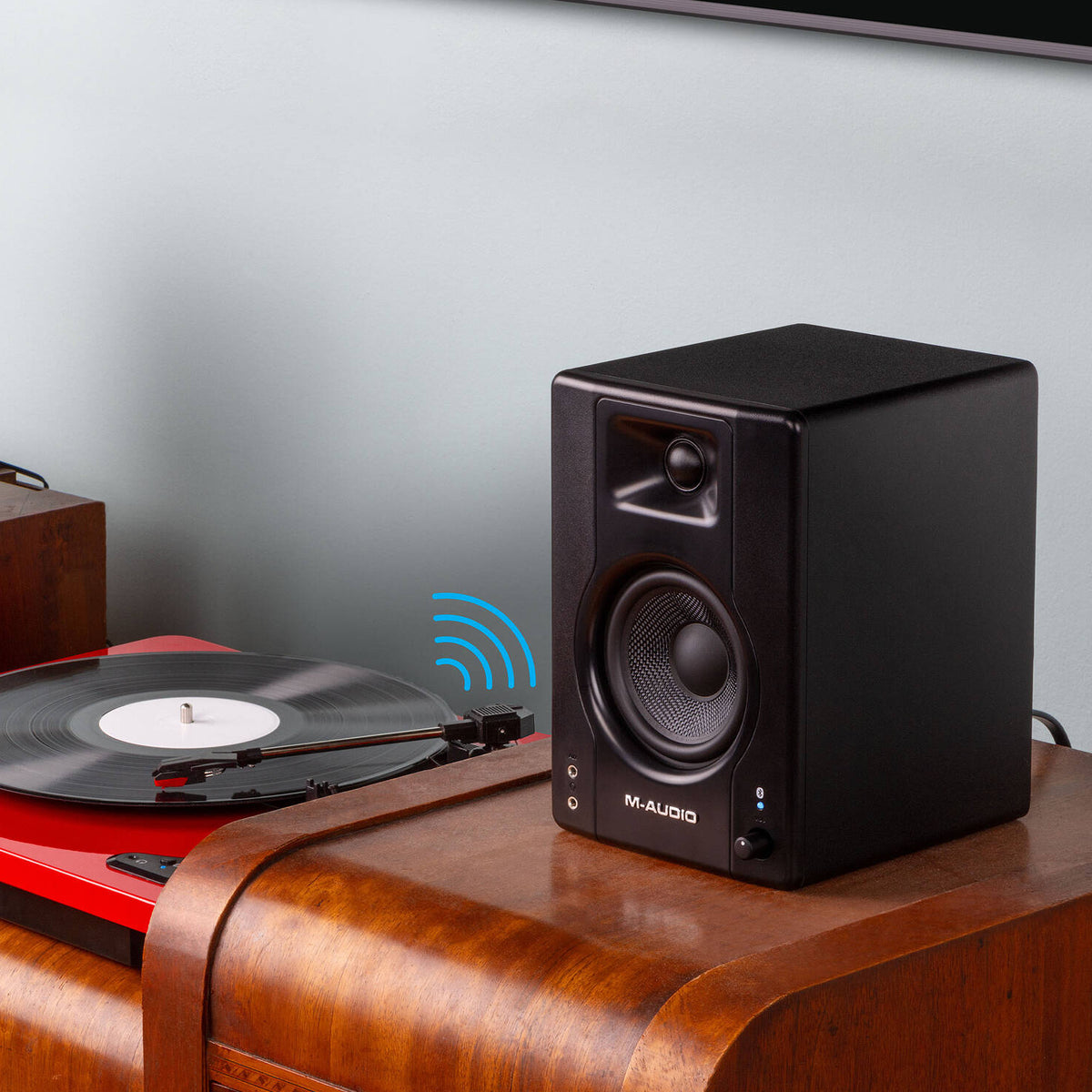 M-Audio BX3 BT desktop speakers with black finish, featuring control knobs and Bluetooth connectivity on a white surface