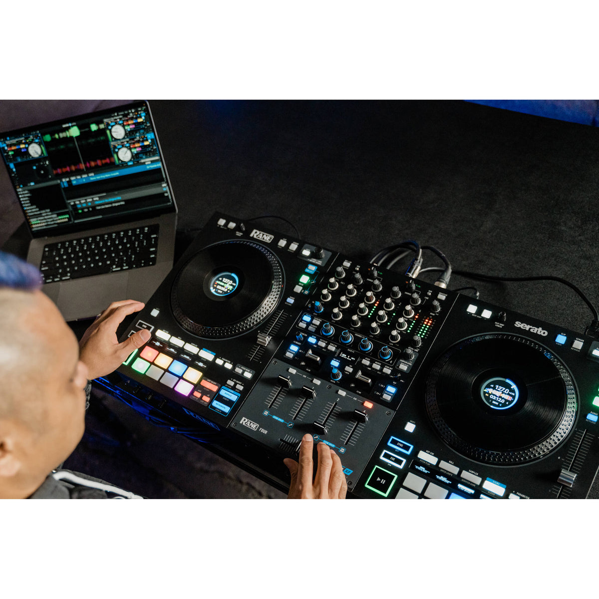Rane Four DJ controller with jog wheels, mixer controls, and performance pads, designed for professional DJ setups.