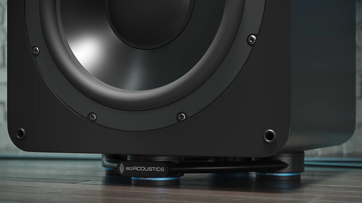 IsoAcoustics Aperta SUB XL speaker stands supporting a subwoofer with a sleek black design and sturdy build.