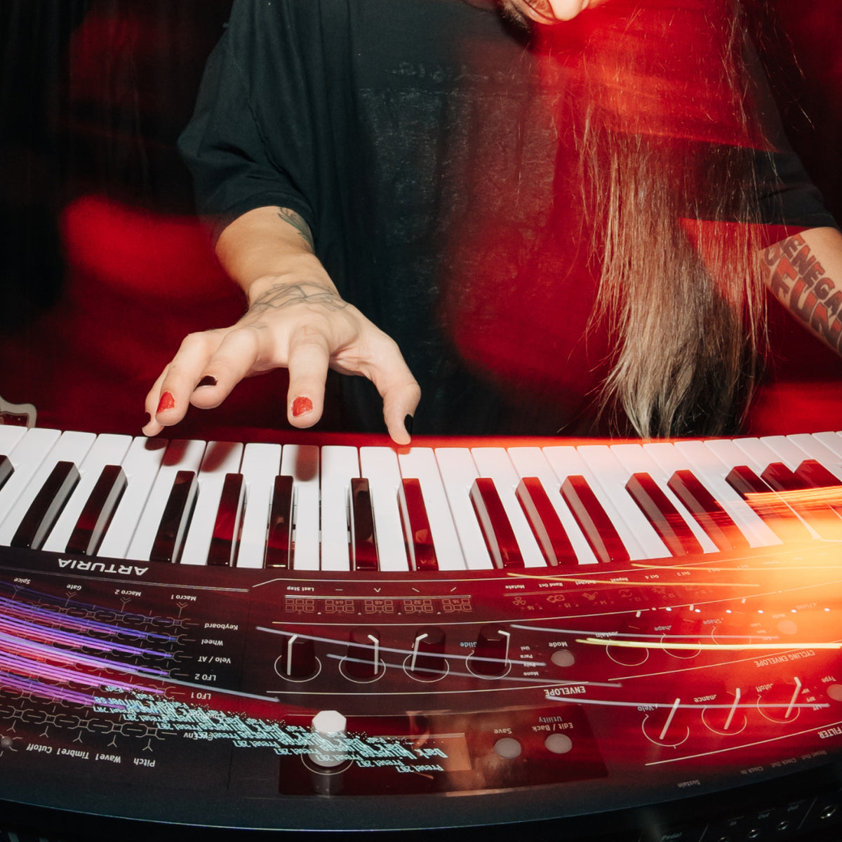 Musician playing the Arturia MiniFreak 49 full-size semi-weighted keyboard