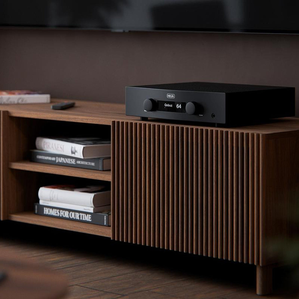 Hegel H200 integrated amplifier on a walnut sideboard
