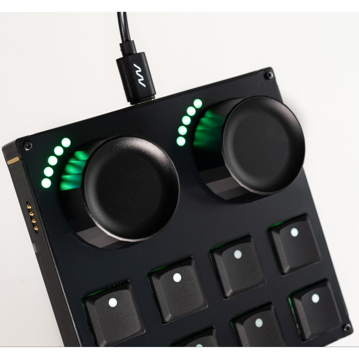 Intech Studio TEK2 Mechanical Series 3 MIDI controller with multiple black keys and control knobs on a sleek surface.