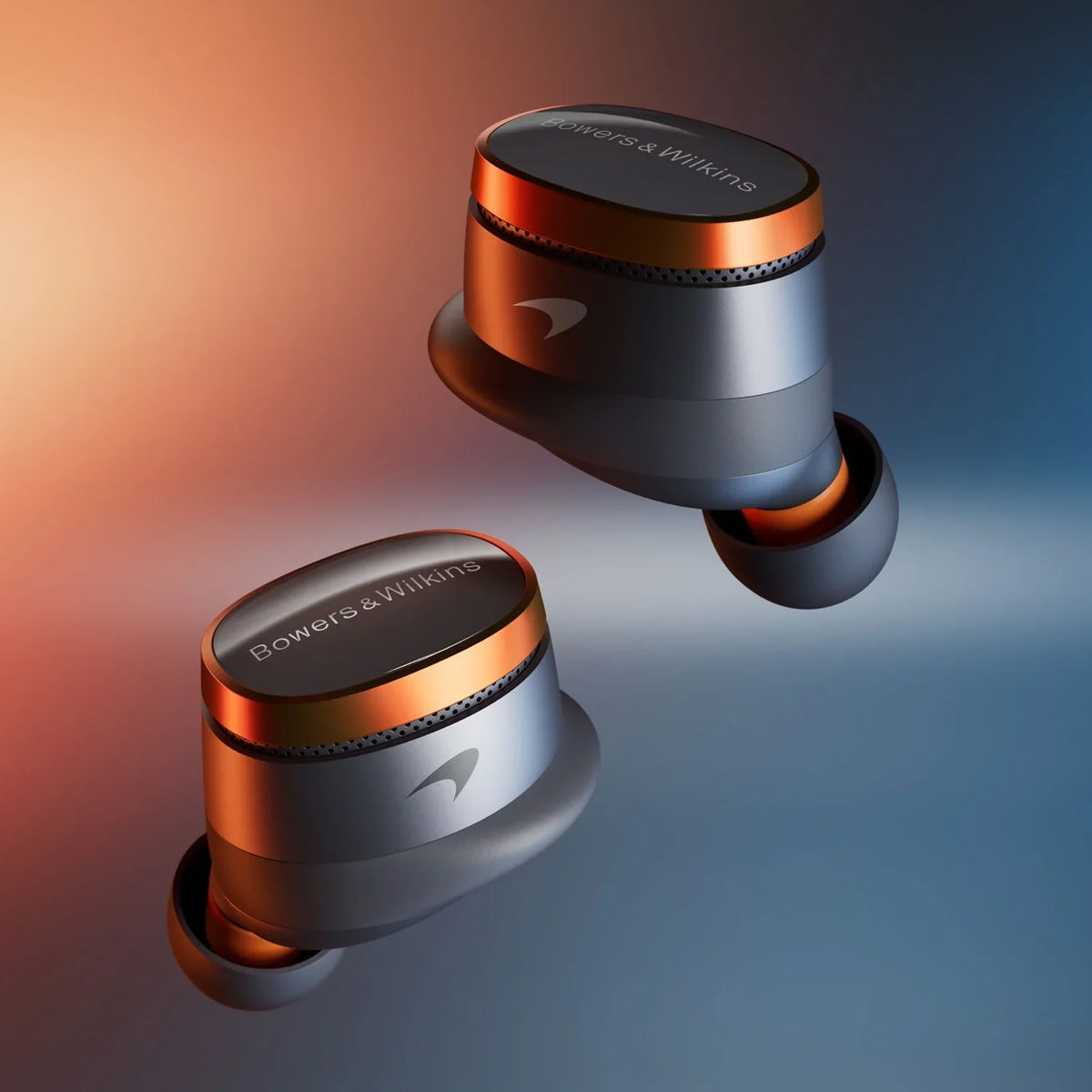 Bowers & Wilkins Pi8 wireless in-ear headphones with sleek design and textured ear tips, featuring McLaren branding details.